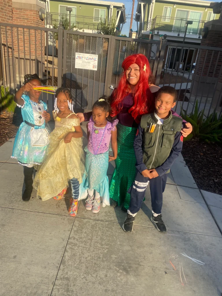group of children in costume with adult