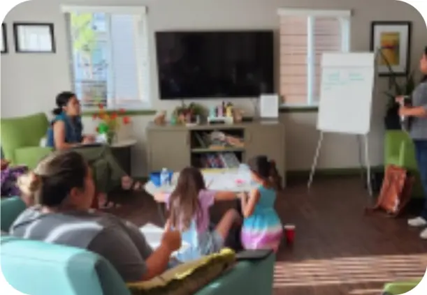 group of people in a room with presenter